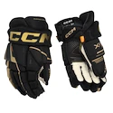 Guanti da hockey CCM Tacks XF Black/Gold Junior 10 pollici